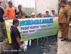 Geliat Padat Karya Tunai di Desa Amansari : Gorong – gorong ( Solokan ) Lancar Warga senang.